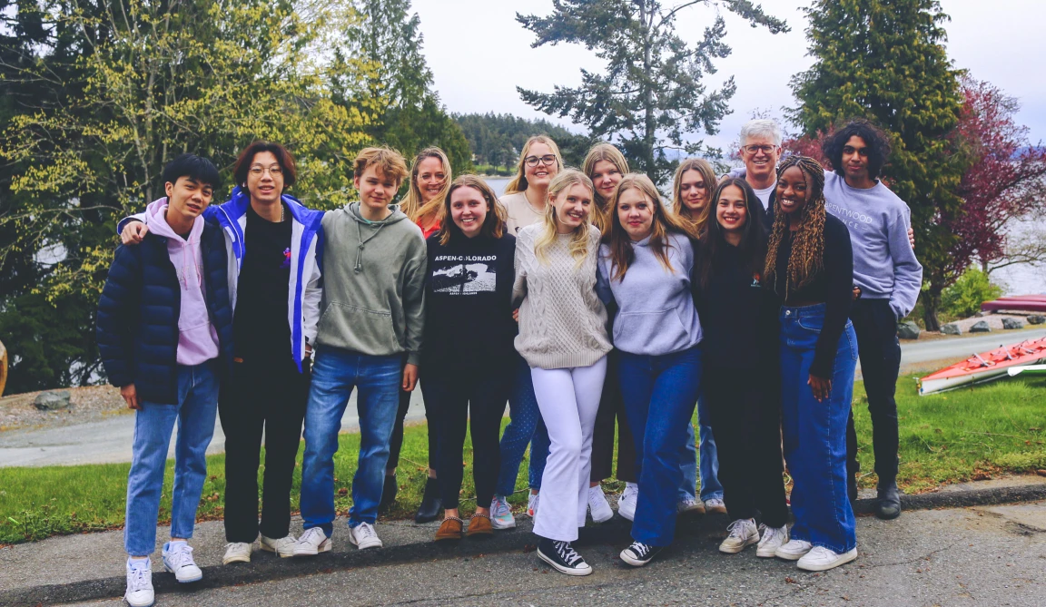The student yearbook team posing together outdoors