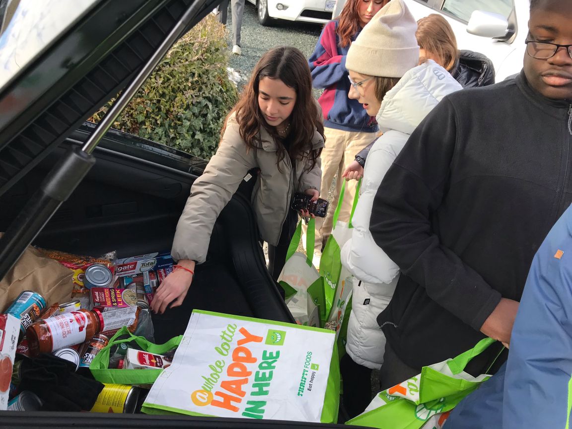 Students organize food donation bags for local non-profit