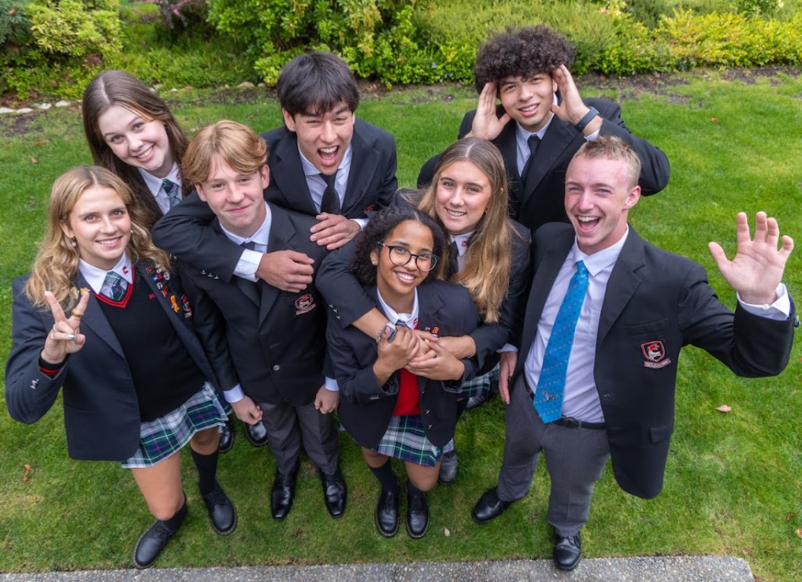 House Captains of 2024/25 smiling up as seen from overhead (selfie-style)