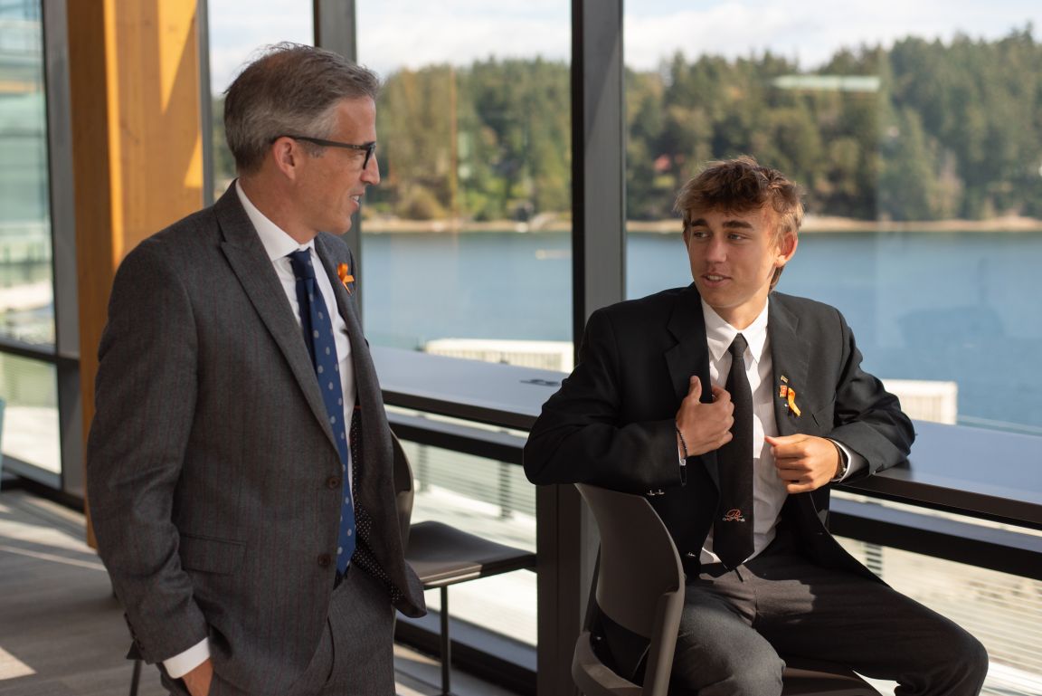 Garth Chalmers talking with a senior student