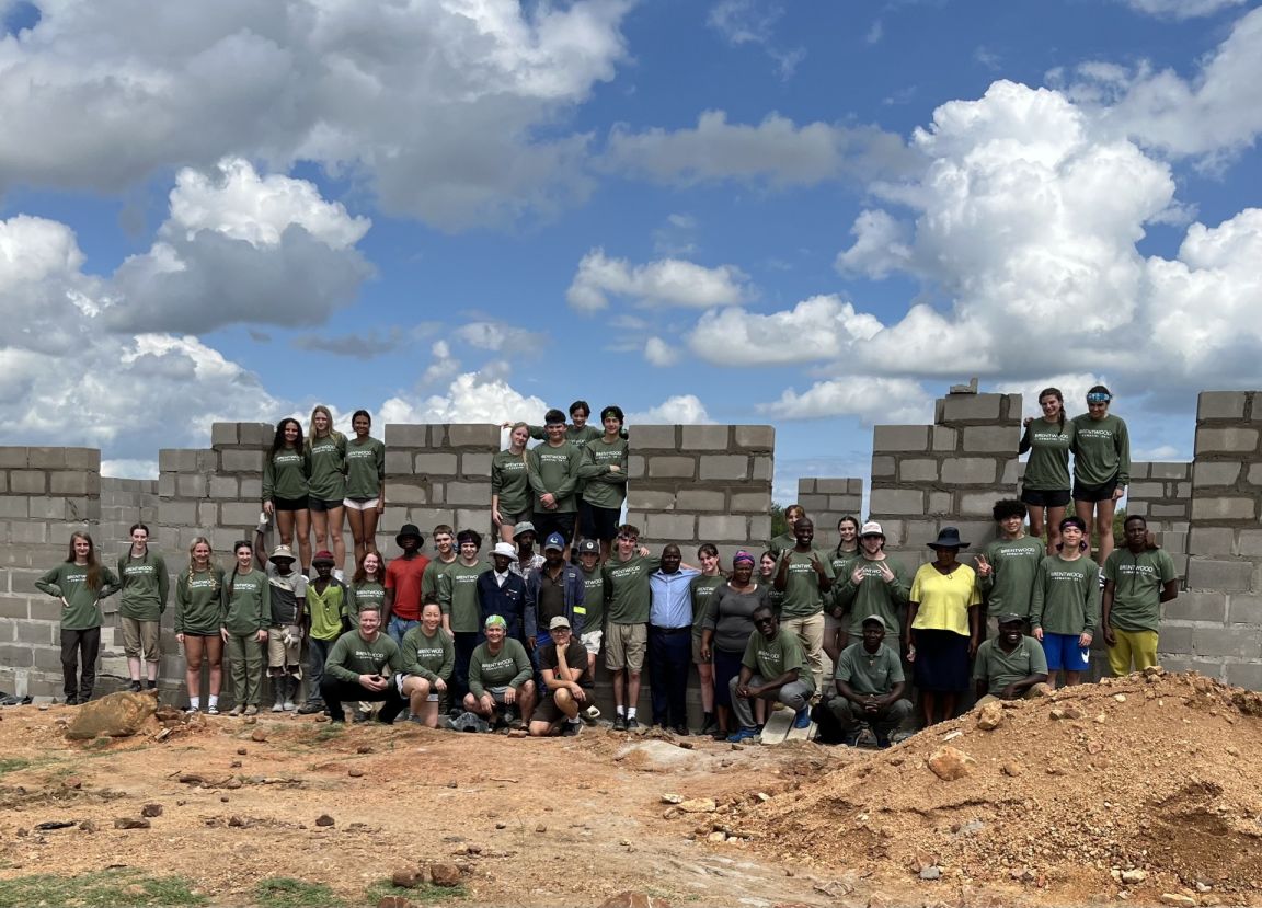 A large group of students at an overseas service-trip building project
