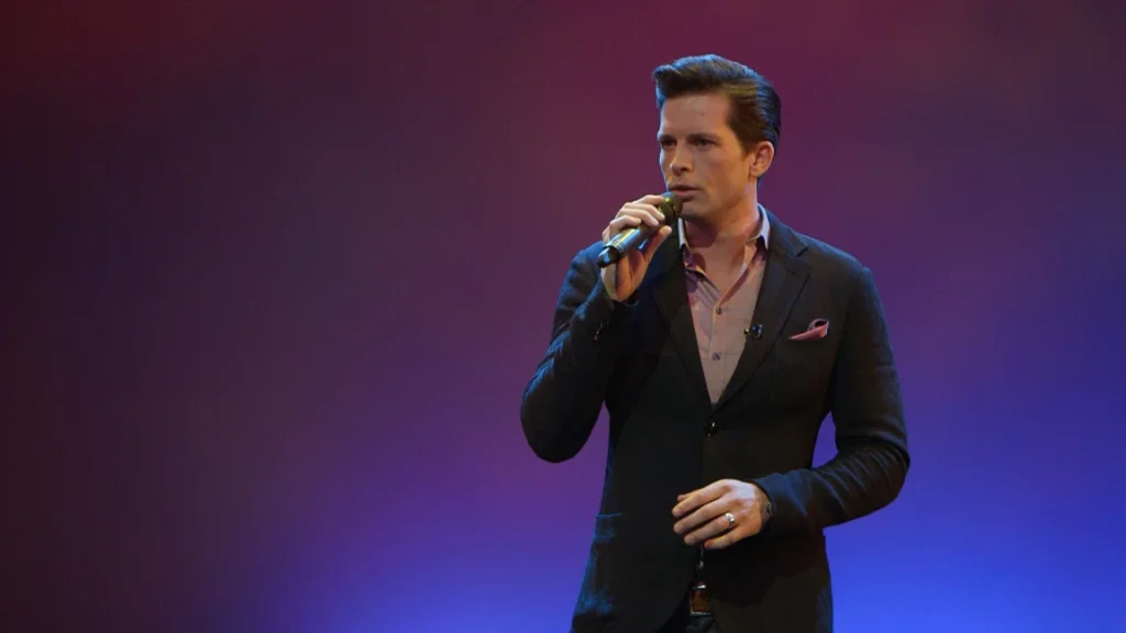 Clifton Murray singing on stage in the arts theatre