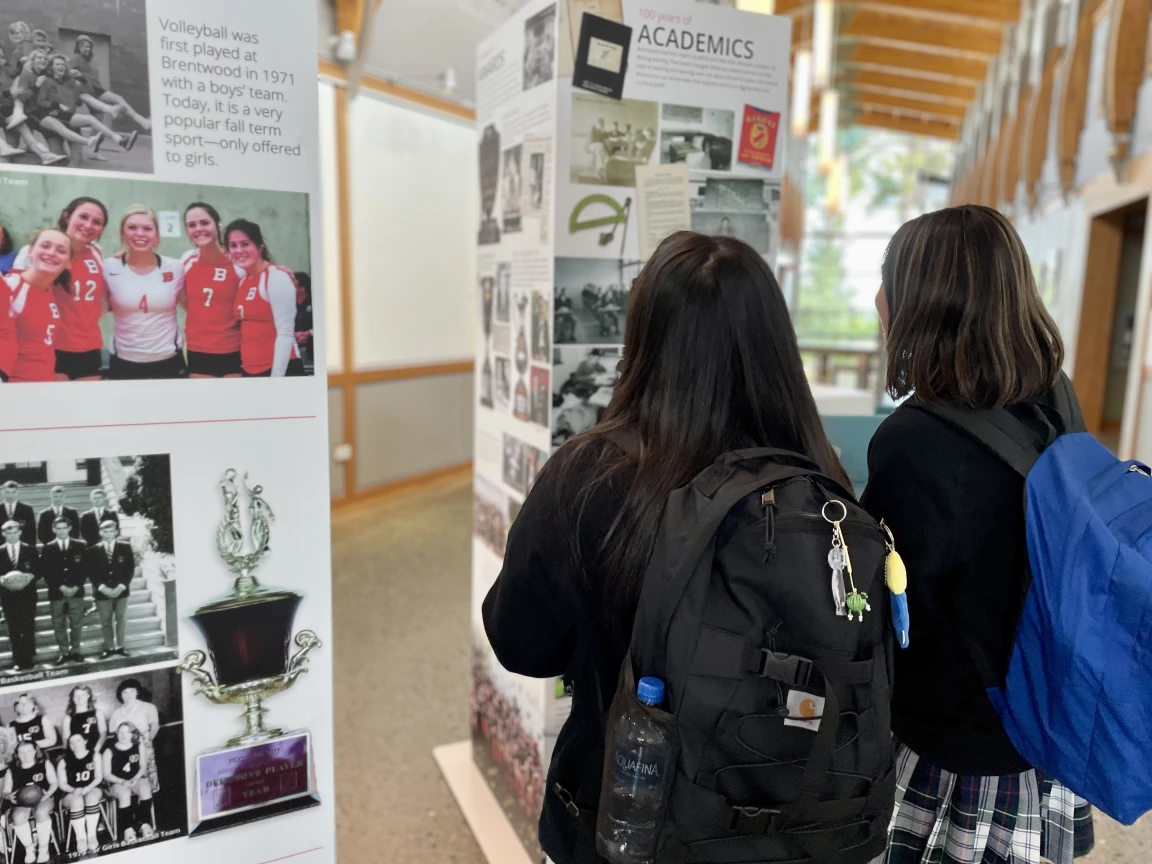 Students looking at a Brentwood history display board