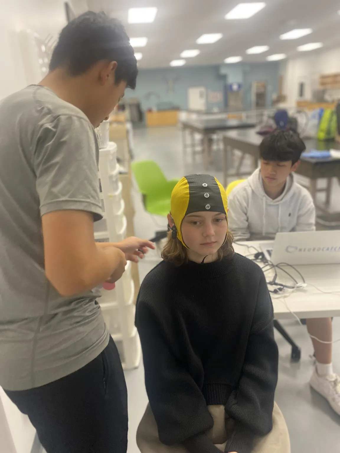 Student-athletes participating in cognitive assessments as part of the BRAIN club's research on sports-related head impacts