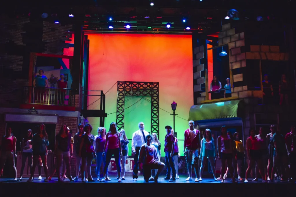 Private school students performing the musical In the Heights on stage