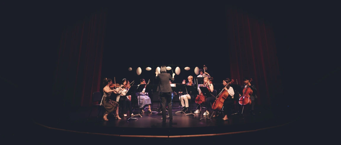 Private school student musicians performing on stage