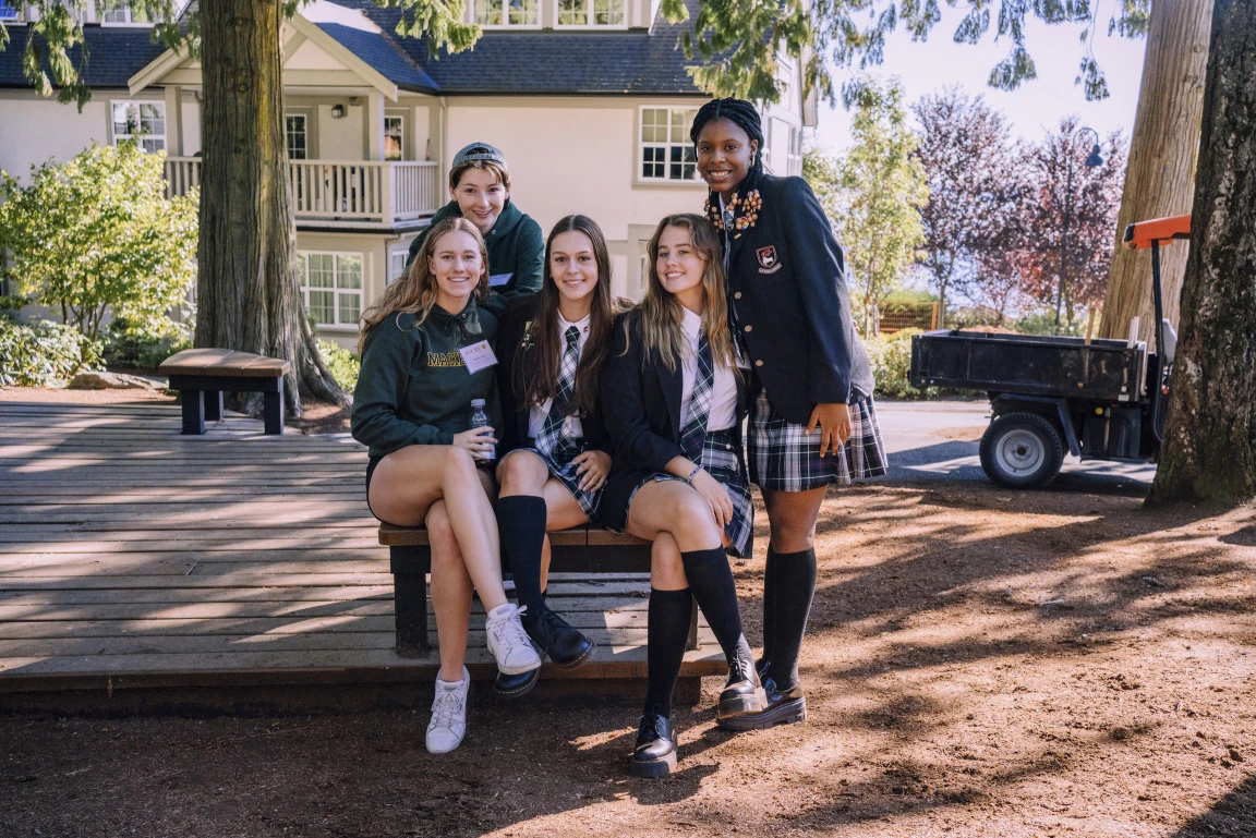 A group of students in uniform smiling
