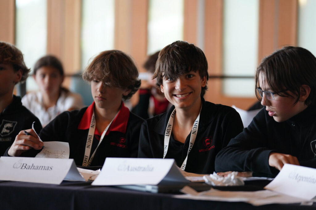 Model UN delegates at a committee table