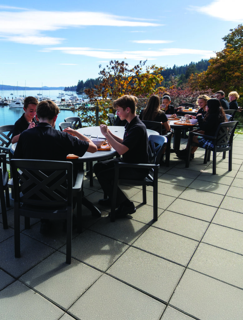 Students eating outdoors overlooking the inlet