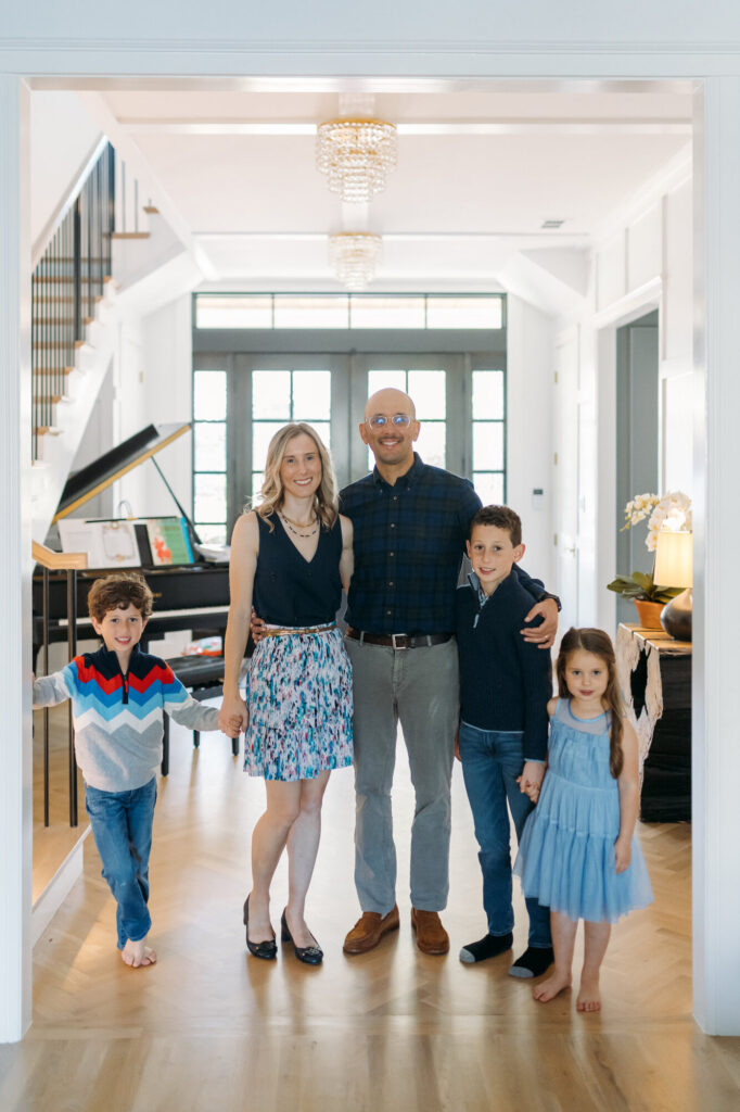 Kris (Larsen) Woldu with her family at home